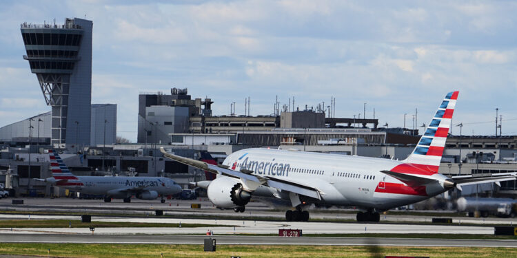 An aircraft lands at Philadelphia International Airport in Philadelphia, Thursday, Nov. 6, 2025. (AP Photo/Matt Rourke)