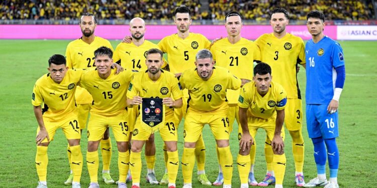Malaysia's players pose before the start of the AFC Asian Cup qualifier Group F football match between Malaysia and Vietnam at the National Stadium Bukit Jalil in Kuala Lumpur on June 10, 2025. (Photo by Mohd RASFAN / AFP)