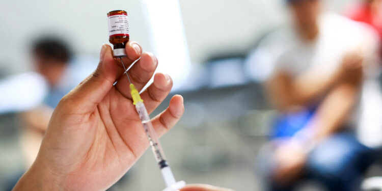 A nurse prepares a dose of the measles vaccine during a vaccination campaign in response to a measles outbreak, at the Estadio Olimpico Universitario in Mexico City, Mexico, November 12, 2025. REUTERS/Raquel Cunha